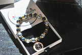 Silver Hematite with Camillia Flower Black and gold beaded bracelet