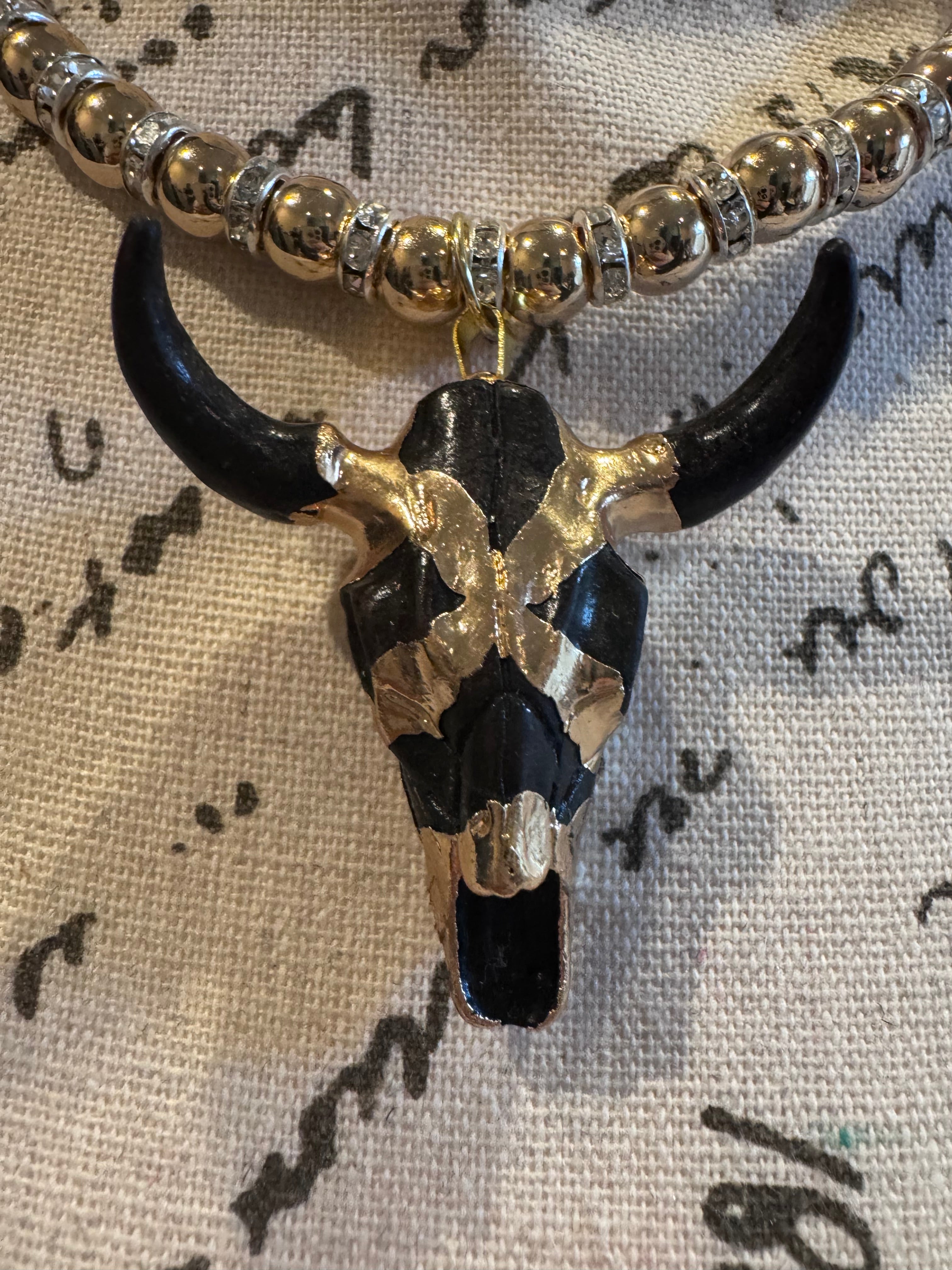 Silver Hematite Necklace with Black and Gold Wrapped Bull Pendent